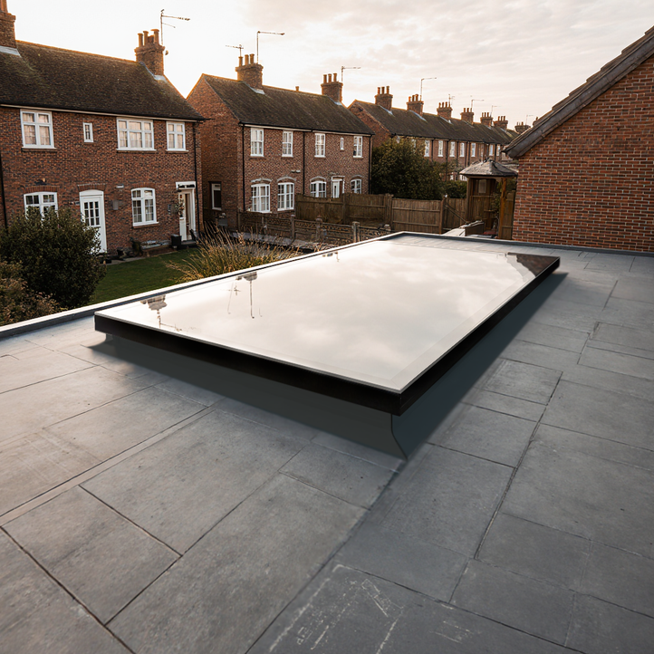 A rooflight on a residential property with houses in the background