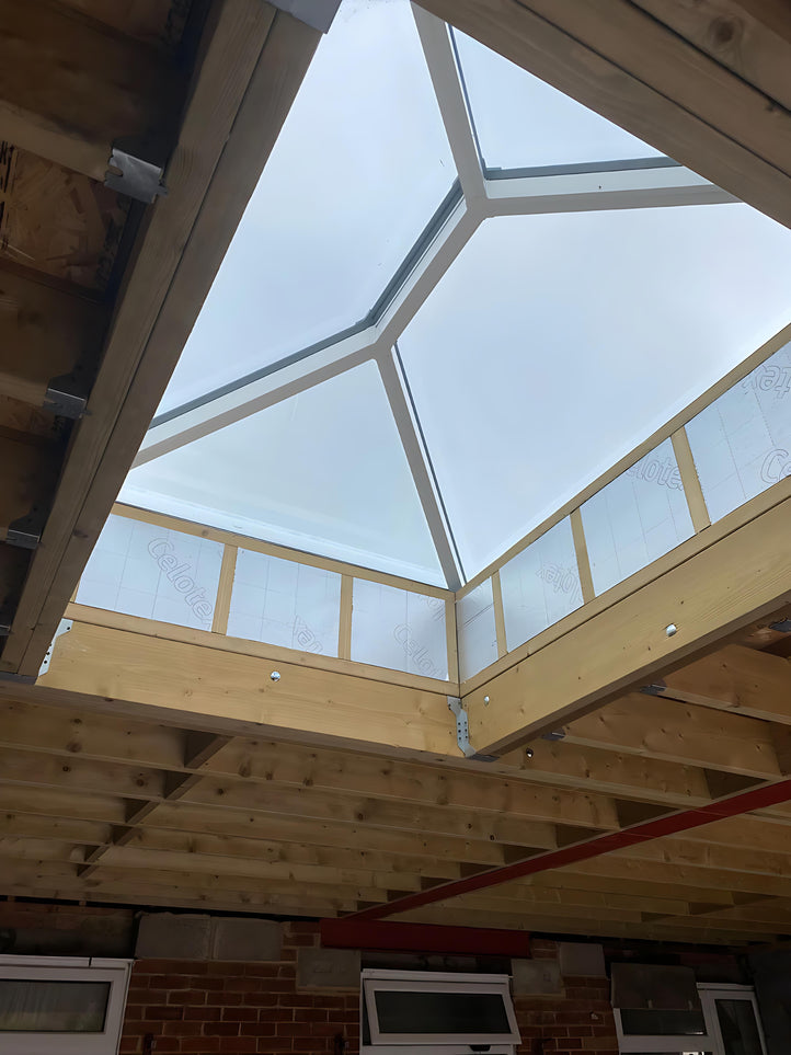 Roof Lantern with wooden beams inside a building.